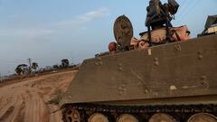 An Israeli solider drives an armored personnel carrier, as military operations continue in the southern Gaza city of Rafah, at an area outside Kerem Shalom, Israel, May 17, 2024. REUTERS/Shannon Stapleton