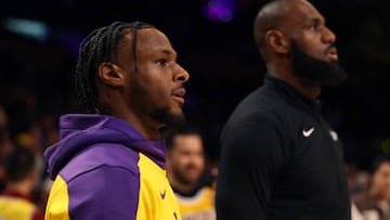 LOS ANGELES, CALIFORNIA - OCTOBER 22: Bronny James #9 and LeBron James #23 of the Los Angeles Lakers warm up prior to the game against the Minnesota Timberwolves at Crypto.com Arena on October 22, 2024 in Los Angeles, California. (Photo by Harry How/Getty Images)