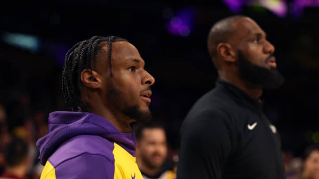 LOS ANGELES, CALIFORNIA - OCTOBER 22: Bronny James #9 and LeBron James #23 of the Los Angeles Lakers warm up prior to the game against the Minnesota Timberwolves at Crypto.com Arena on October 22, 2024 in Los Angeles, California. (Photo by Harry How/Getty Images)