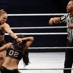 Why did former UFC champion Ronda Rousey get suspended indefinitely at SummerSlam?