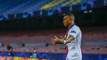 PSG&#039;s Kylian Mbappe celebrates after scoring his side&#039;s second goal during the Champions League round of 16, first leg soccer match between FC Barcelona and Paris Saint-Germain at the Camp Nou stadium in Barcelona, Spain, Tuesday, Feb. 16, 2021.