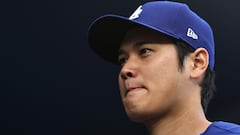 LOS ANGELES, CALIFORNIA - MARCH 25: Shohei Ohtani #17 of the Los Angeles Dodgers walks into the dugout prior to a game against the Los Angeles Angels at Dodger Stadium on March 25, 2024 in Los Angeles, California.   Michael Owens/Getty Images/AFP (Photo by Michael Owens / GETTY IMAGES NORTH AMERICA / Getty Images via AFP)