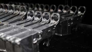 FILE PHOTO: Aluminum 80% lower receivers for AR-15 rifles are displayed for sale at Firearms Unknown, a gun store in Oceanside, California, U.S., April 12, 2021. Unfinished and inoperable so-called "80% receivers" are not legally considered firearms and do not require background checks to purchase in most states, but can be used to assemble un-serialized "ghost guns". REUTERS/Bing Guan/File Photo