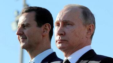 FILE PHOTO: FILE PHOTO: Russian President Vladimir Putin (R) and Syrian President Bashar al-Assad visit the Hmeymim air base in Latakia Province, Syria December 11, 2017. Picture taken December 11, 2017. To match Special Report RUSSIA-FLIGHTS/ Sputnik/Mikhail Klimentyev/ via REUTERS/File Photo ATTENTION EDITORS - THIS IMAGE WAS PROVIDED BY A THIRD PARTY./File Photo/File Photo