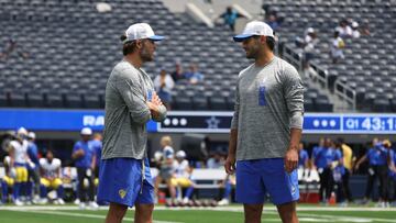 INGLEWOOD, CALIFORNIA - AUGUST 11: Matthew Stafford #9 and Jimmy Garoppolo #11 of the Los Angeles Rams talk on the filed before a preseason game against the Dallas Cowboys at SoFi Stadium on August 11, 2024 in Inglewood, California. Harry How/Getty Images/AFP (Photo by Harry How / GETTY IMAGES NORTH AMERICA / Getty Images via AFP)