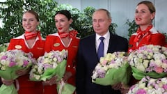 Russian President Vladimir Putin congratulates women on the upcoming International Women&#039;s Day as he meets with flight personnel, students and employees of the Aeroflot Aviation School on the suburbs of Moscow, Russia March 5, 2022.