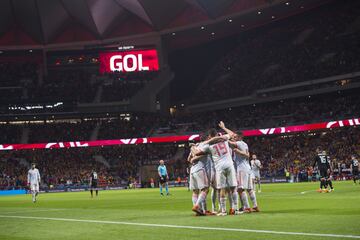 Isco celebrates after scoring with his team mates.