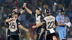 New Zealand players celebrate after defeating India. 