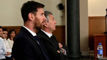 Barcelona&#039;s Argentine soccer player Lionel Messi (L) sits in court with his father Jorge Horacio Messi during their trial for tax fraud in Barcelona, Spain, June 2, 2016. REUTERS/Alberto Estevez/Pool/Files     TPX IMAGES OF THE DAY     