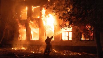 A firefighter extinguishes a burning hospital building hit by a Russian missile strike, as Russia's attack on Ukraine continues, in Mykolaiv, Ukraine August 1, 2022.  REUTERS/Stanislav Kozliuk