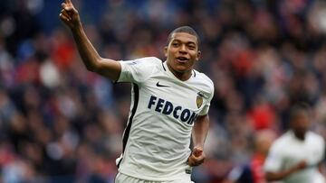 Monaco's French forward Kylian Mbappe Lottin celebrates after scoring a goal during the French L1 football match between Caen (SMC) and Monaco (AS), on March 19, 2017 at the Michel d'Ornano stadium, in Caen, northwestern France. / AFP PHOTO / CHARLY TRIBALLEAU