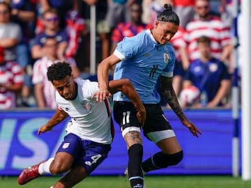 Tyler Adams #4 of the United States defends against Darwin Nuñez #11 of Uruguay