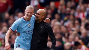Soccer Football - FA Cup - Semi Final - Manchester City v Sheffield United - Wembley Stadium, London, Britain - April 22, 2023 Manchester City's Erling Braut Haaland with manager Pep Guardiola after being substituted Action Images via Reuters/Jason Cairnduff