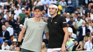 (L-R) Italy's Jannik Sinner and USA's Taylor Fritz stand together before the start of their men's final match on day fourteen of the US Open tennis tournament at the USTA Billie Jean King National Tennis Center in New York City, on September 8, 2024. (Photo by ANGELA WEISS / AFP)
