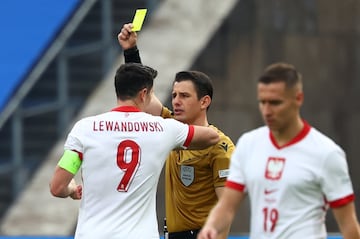 Meler books Poland striker Robert Lewandowski during Austria's 3-1 Group D win.
