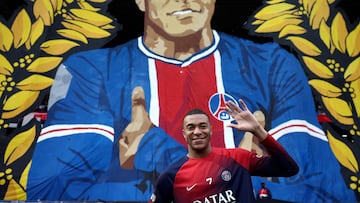Paris Saint-Germain's French forward #07 Kylian Mbappe poses in front of a giant tifo before the French L1 football match between Paris Saint-Germain (PSG) and Toulouse (TFC) on May 12, 2024 at the Parc des Princes stadium in Paris. This game will be Mbappe's final home game after he confirmed on May 10 he will leave the French champions at the end of the season, with Real Madrid widely expected to be his next destination. (Photo by FRANCK FIFE / AFP)