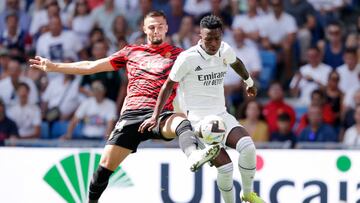 MADRID, SPAIN - SEPTEMBER 11: Martin Valjent of Real Mallorca, Vinicius Junior of Real Madrid  during the La Liga Santander  match between Real Madrid v Real Mallorca at the Estadio Santiago Bernabeu on September 11, 2022 in Madrid Spain (Photo by David S. Bustamante/Soccrates/Getty Images)