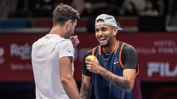 Nick Kyrgios of Australia (R) and Thanasi Kokkinakis of Australia celebrate a point against Kaichi Uchida of Japan and Yoshihito Nishioka of Japan during their men's doubles match at the Japan Open tennis tournament in Tokyo on October 5, 2022. (Photo by Yuichi YAMAZAKI / AFP)