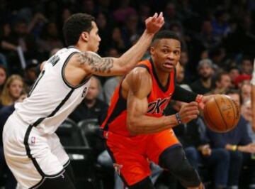 Jan 24, 2016; Brooklyn, NY, USA; Brooklyn Nets guard Shane Larkin (0) defends against Oklahoma City Thunder guard Russell Westbrook (0) during first half at Barclays Center. Mandatory Credit: Noah K. Murray-USA TODAY Sports