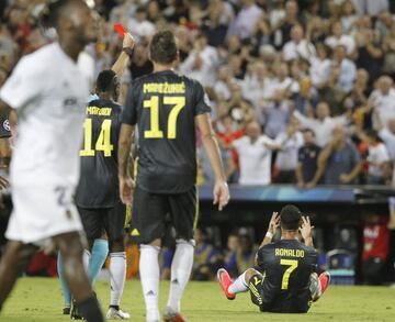 Referee Felix Brych brandishes the red card at Ronaldo