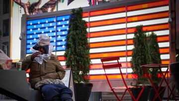 A person sits in Times Square, after New York City Mayor Eric Adams announced that homeless people deemed to be in psychiatric crisis can be involuntarily hospitalized, in Manhattan, New York City, U.S., December 1, 2022. REUTERS/Andrew Kelly