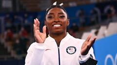 Simone Biles marks return with beam bronze