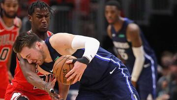 CHICAGO, ILLINOIS - MARCH 02: Luka Doncic #77 of the Dallas Mavericks runs into Adam Mokoka #20 of the Chicago Bulls at the United Center on March 02, 2020 in Chicago, Illinois. The Bulls defeated the Mavericks 109-107. NOTE TO USER: User expressly acknowledges and agrees that, by downloading and or using this Photograph, user is consenting to the terms and conditions of the Getty Images License Agreement.   Jonathan Daniel/Getty Images/AFP
 == FOR NEWSPAPERS, INTERNET, TELCOS &amp; TELEVISION USE ONLY ==