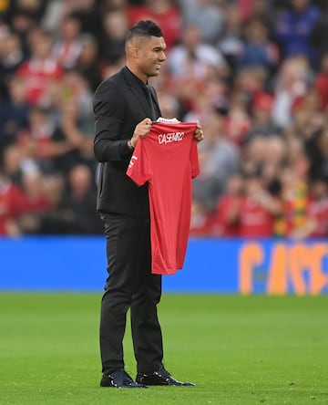 MANCHESTER, ENGLAND - AUGUST 22: New signing, Casemiro of Manchester United poses with a shirt prior to the Premier League match between Manchester United and Liverpool FC at Old Trafford on August 22, 2022 in Manchester, England. (Photo by Michael Regan/Getty Images)