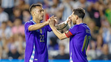 Argentina's forward #10 Lionel Messi and Argentina's forward #22 Lautaro Martinez celebrate a goal during the international friendly football match between Argentina and Puerto Rico at Chase Stadium in Fort Lauderdale, Florida, on October 14, 2025. (Photo by Chris Arjoon / AFP)