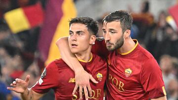 AS Roma's Argentinian forward Paulo Dybala (L) and AS Roma's Italian midfielder Bryan Cristante celebrate after winning the UEFA Europa League semi-final first leg football match between AS Roma and Bayer Leverkusen at the Olympic Stadium in Rome on May 11, 2023. (Photo by Alberto PIZZOLI / AFP)