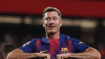 Barcelona's Polish forward #09 Robert Lewandowski celebrates scoring his team's sixth goal during the Spanish league football match between FC Barcelona and Valencia CF at Johan Cruyff Stadium in Barcelona, on September 14, 2025. (Photo by Lluis GENE / AFP)