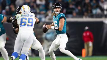 JACKSONVILLE, FLORIDA - JANUARY 14: Trevor Lawrence #16 of the Jacksonville Jaguars throws a pass against the Los Angeles Chargers during the first half of the game in the AFC Wild Card playoff game at TIAA Bank Field on January 14, 2023 in Jacksonville, Florida.   Courtney Culbreath/Getty Images/AFP (Photo by Courtney Culbreath / GETTY IMAGES NORTH AMERICA / Getty Images via AFP)