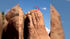 Un piloto de MTB a punto de bajar por una empinada monta&ntilde;a en el desierto del Moab (Utah, Estados Unidos).