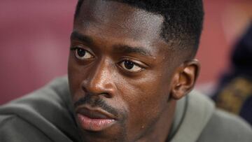 Barcelona's French forward Ousmane Dembele looks on from the bench during the Spanish League football match between Barcelona and Real Betis at the Camp Nou stadium in Barcelona on August 25, 2019. (Photo by Josep LAGO / AFP)