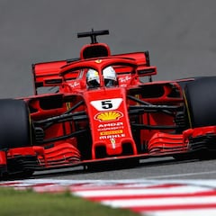Vettel snatches pole from Raikkonen as Ferrari dominate in Shanghai