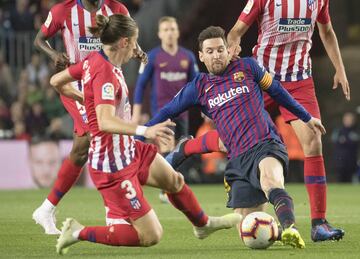 Messi y Filipe Luis.