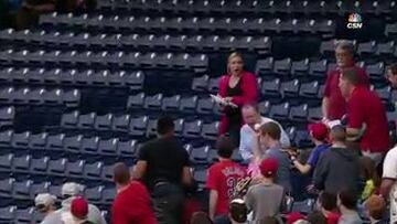 Instinctive catch from father at baseball match with daughter
