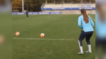 Female footballer controls ball on heel and hits volley