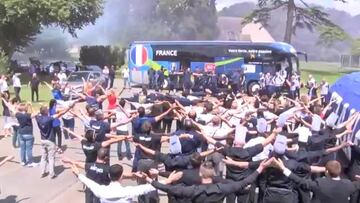 Smoke bombs and Viking clap hotel welcome for France