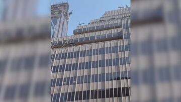 Chaotic scene unfolds in NYC: individual throws patio furniture and debris from Midtown skyscraper