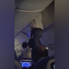 Severe turbulence threw a passenger into an overhead compartment