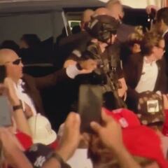 Female secret service agent struggles with weapon during attempted assassination of Trump