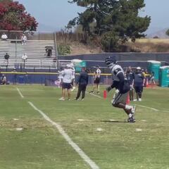 Brawl erupts: Cowboys’ DT Albert Huggins shoves Rams staff member after the play