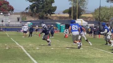 Brawl erupts: Cowboys’ DT Albert Huggins shoves Rams staff member after the play