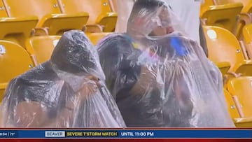 Poncho-wearing beer hero steals the show during Steelers vs Cowboys pre-game storm!