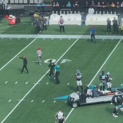 Chris Olave suffers brutal double tackle, exits field with dignity after teammate support