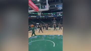 Luka Doncic drains halfcourt shot on first try, makes coaches do pushups