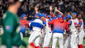 Team Cuba celebrates their victory during the World Baseball Classic (WBC) quarter-final game between Cuba and Australia at the Tokyo Dome in Tokyo on March 15, 2023. (Photo by Philip FONG / AFP)