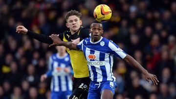WATFORD, ENGLAND - DECEMBER 14: Sean Murray of Watford is challenged by Jose Semedo of Sheffield Wednesday during the the Sky Bet Championship match between Watford and Sheffield Wednesday at Vicarage Road on December 14, 2013 in Watford, England, (Photo by Robin Parker/Getty Images)