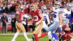 SANTA CLARA, CALIFORNIA - JANUARY 22: Christian McCaffrey #23 of the San Francisco 49ers rushes for a touchdown against the Dallas Cowboys during the fourth quarter in the NFC Divisional Playoff game at Levi's Stadium on January 22, 2023 in Santa Clara, California.   Thearon W. Henderson/Getty Images/AFP (Photo by Thearon W. Henderson / GETTY IMAGES NORTH AMERICA / Getty Images via AFP)